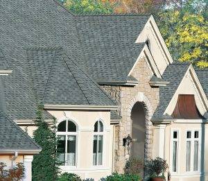 two-story house with gray slate asphalt shingles on the roof