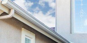 white gutter on the edge of a roof