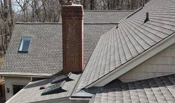 red brick chimney on gray roof