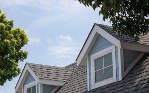 Blue home with new asphalt roof