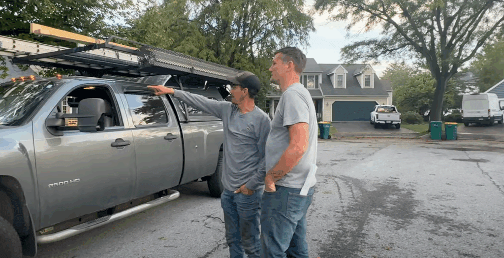 A Joyland Subcontractor and a Joyland Project Manager making sure all the final details of a project are in place before beginning to tear off the roof. 